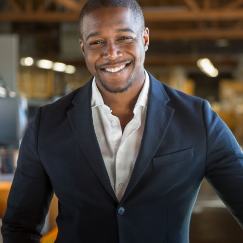 Handsome man wearing a sports jacket over a dress shirt